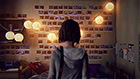 Max consults the ‘Max Caulfield Photo Memorial Wall’ – a display of moments she has captured on film.
